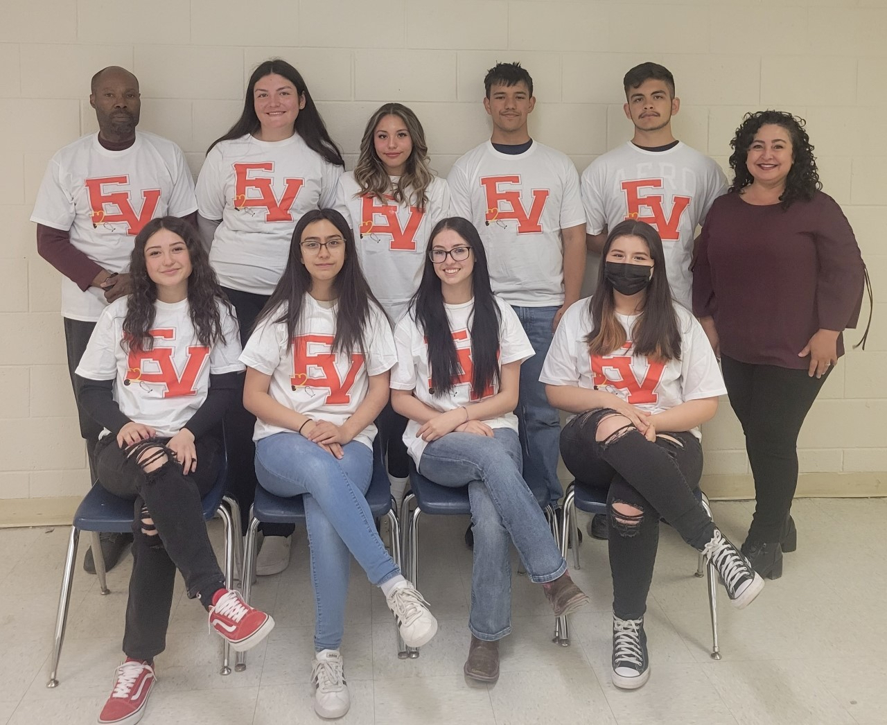 Española Healthcare Career Pathways Project sitting wearing their school T-shirts.
