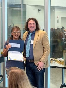 Evelyn Sanchez of the NM-NBCT presents Michael Dabrieo, Education Enrichment Director, with the Building Capacity award in Artesia, NM on September 16, 2023.